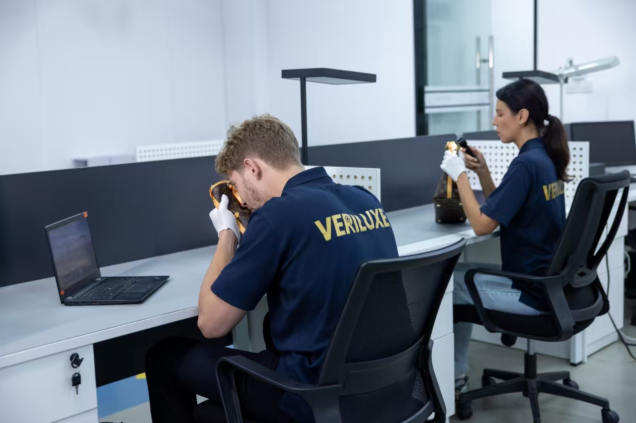 Veriluxe luxury authentication specialists examining handbags
